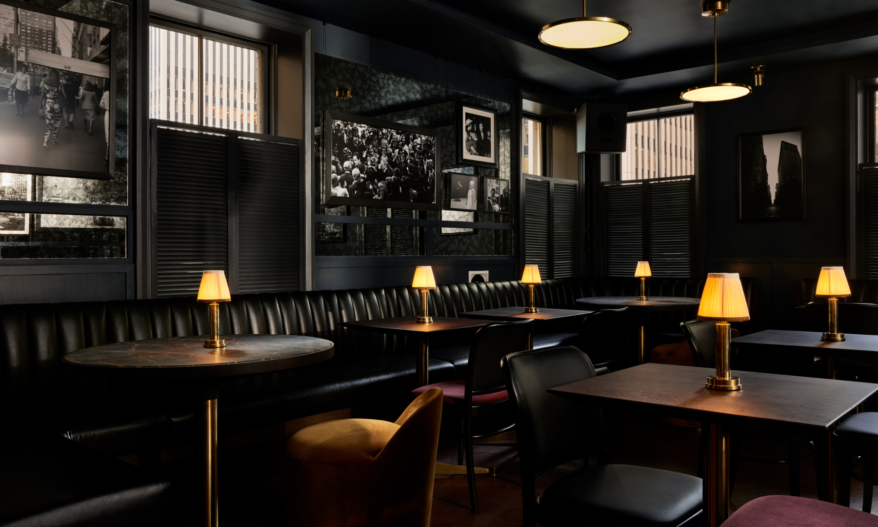 Tables and booths inside Pebble Bar at Rockefeller Center