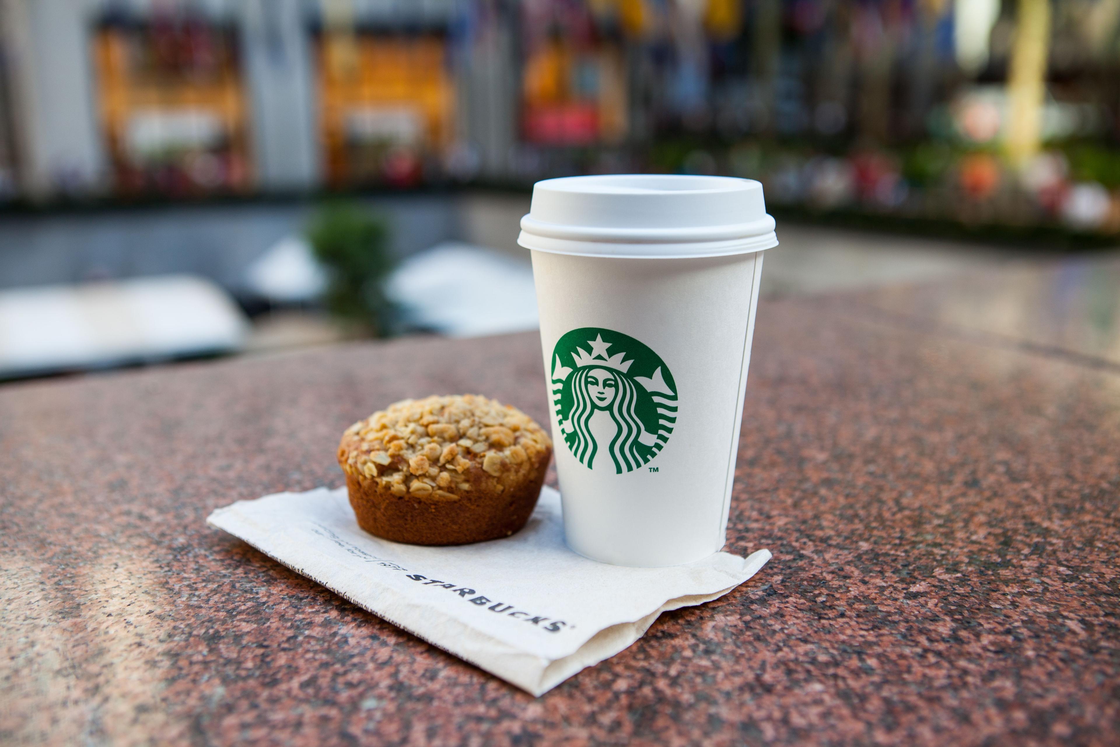 Starbucks cup and breakfast muffin