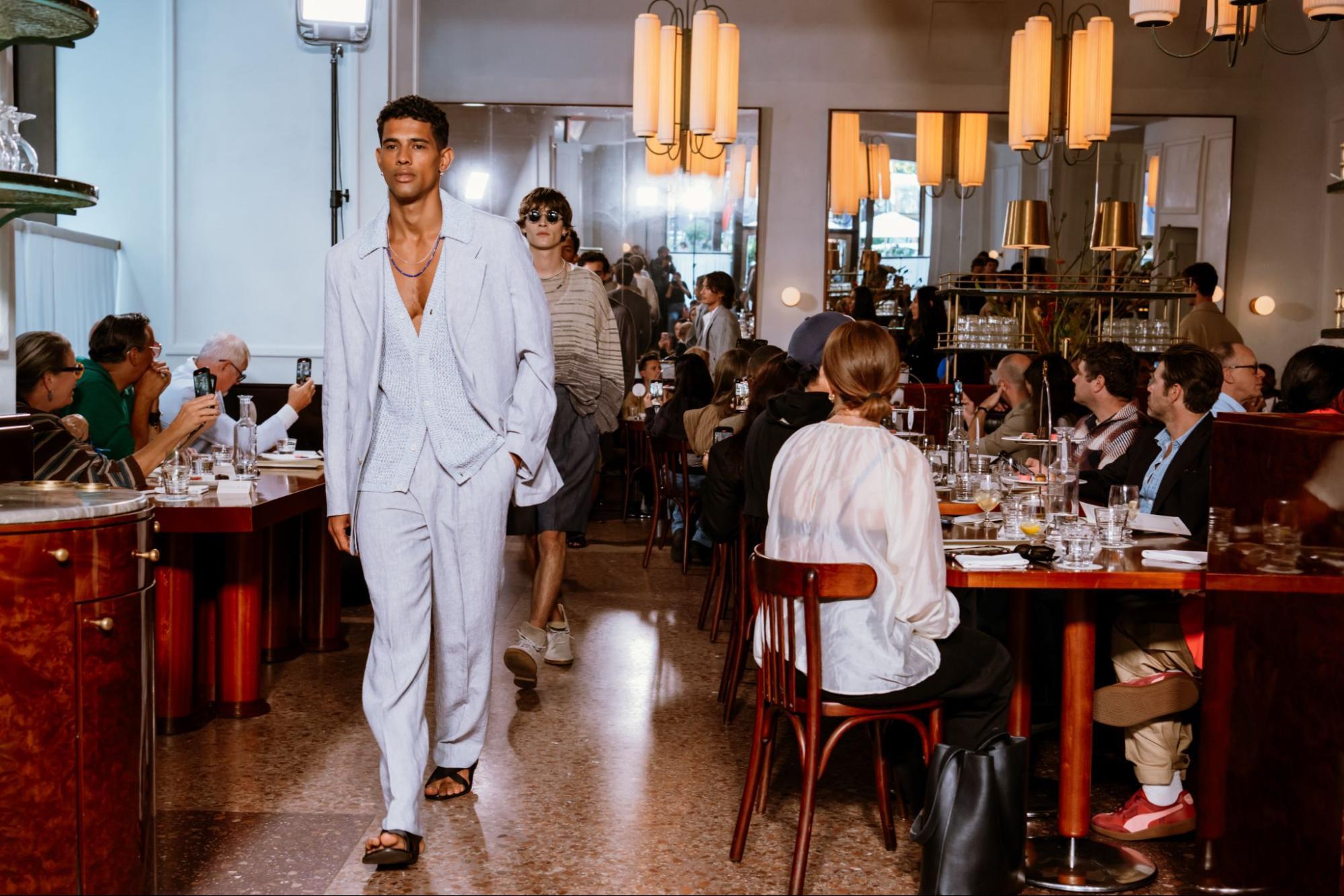Models walking through restaurant
