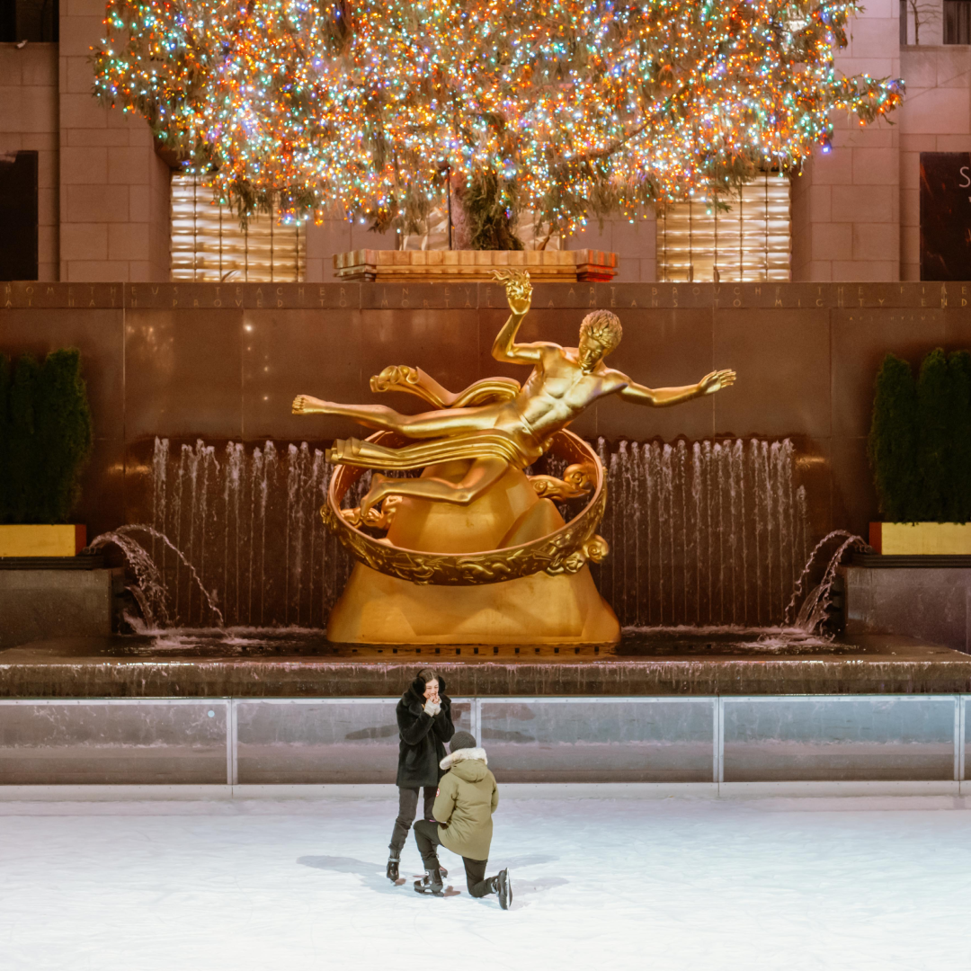 A man proposing to a woman on The Rink at Rockefeller Center