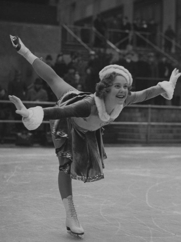 Black-and-white photo of figure skater Sonja Henie performing on the ice at Rockefeller Center in the 1930s.