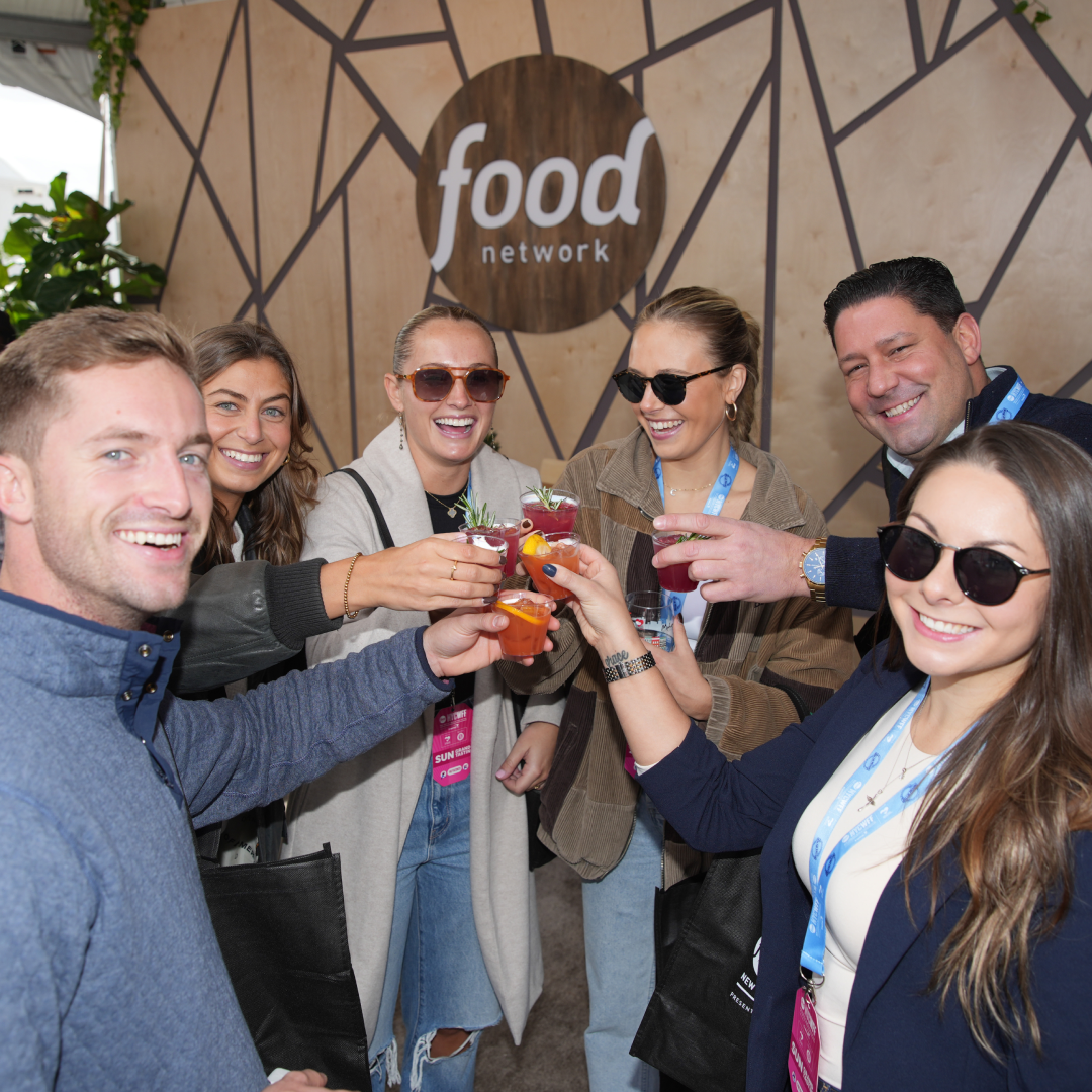 A group of people attending the New York City Wine & Food Festival