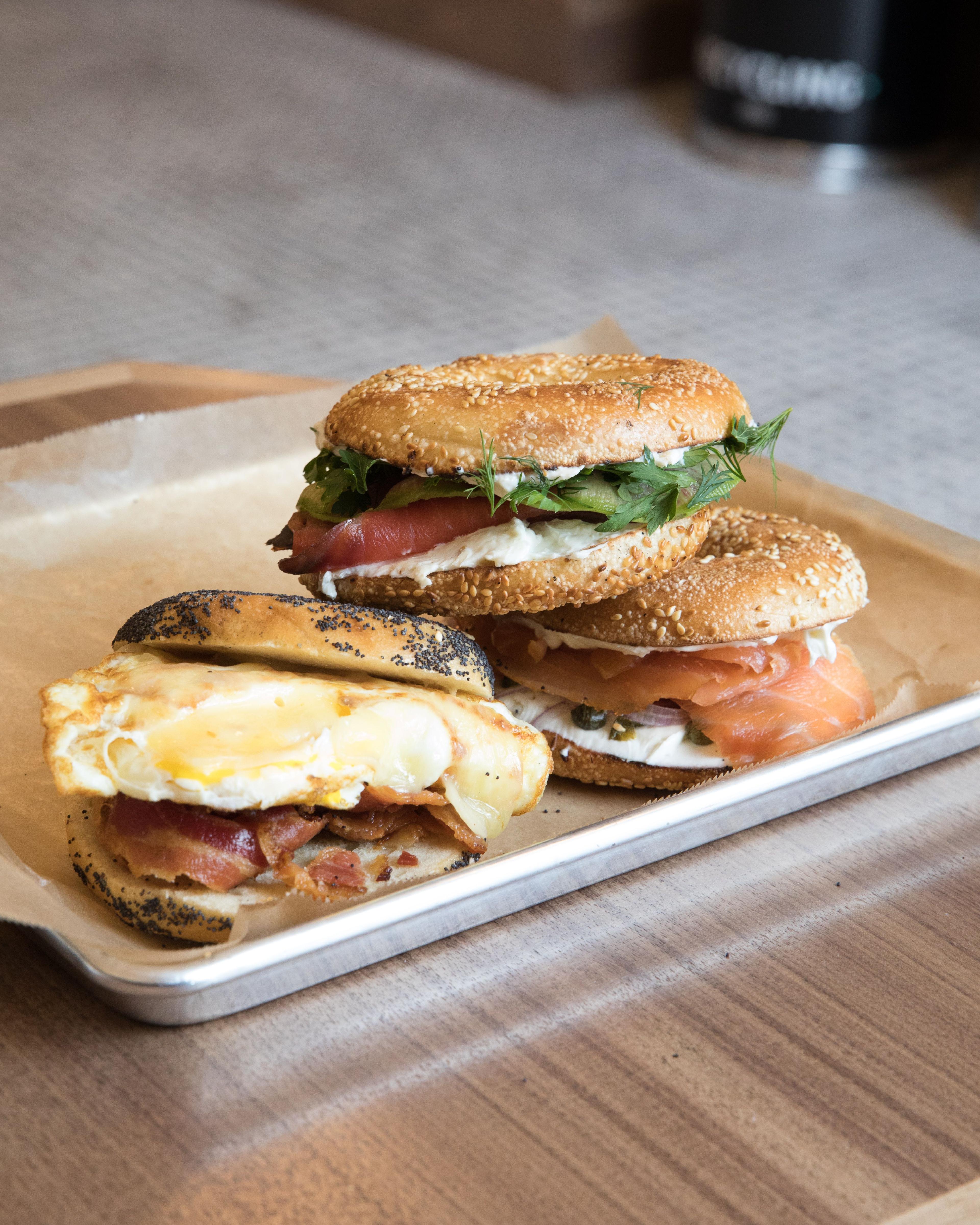 three bagel sandwiches stacked