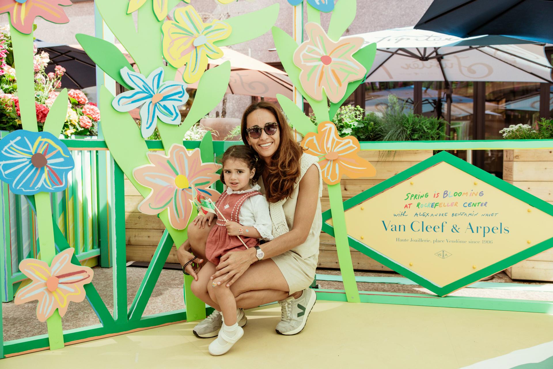 mother and daughter smiling at rockefeller center
