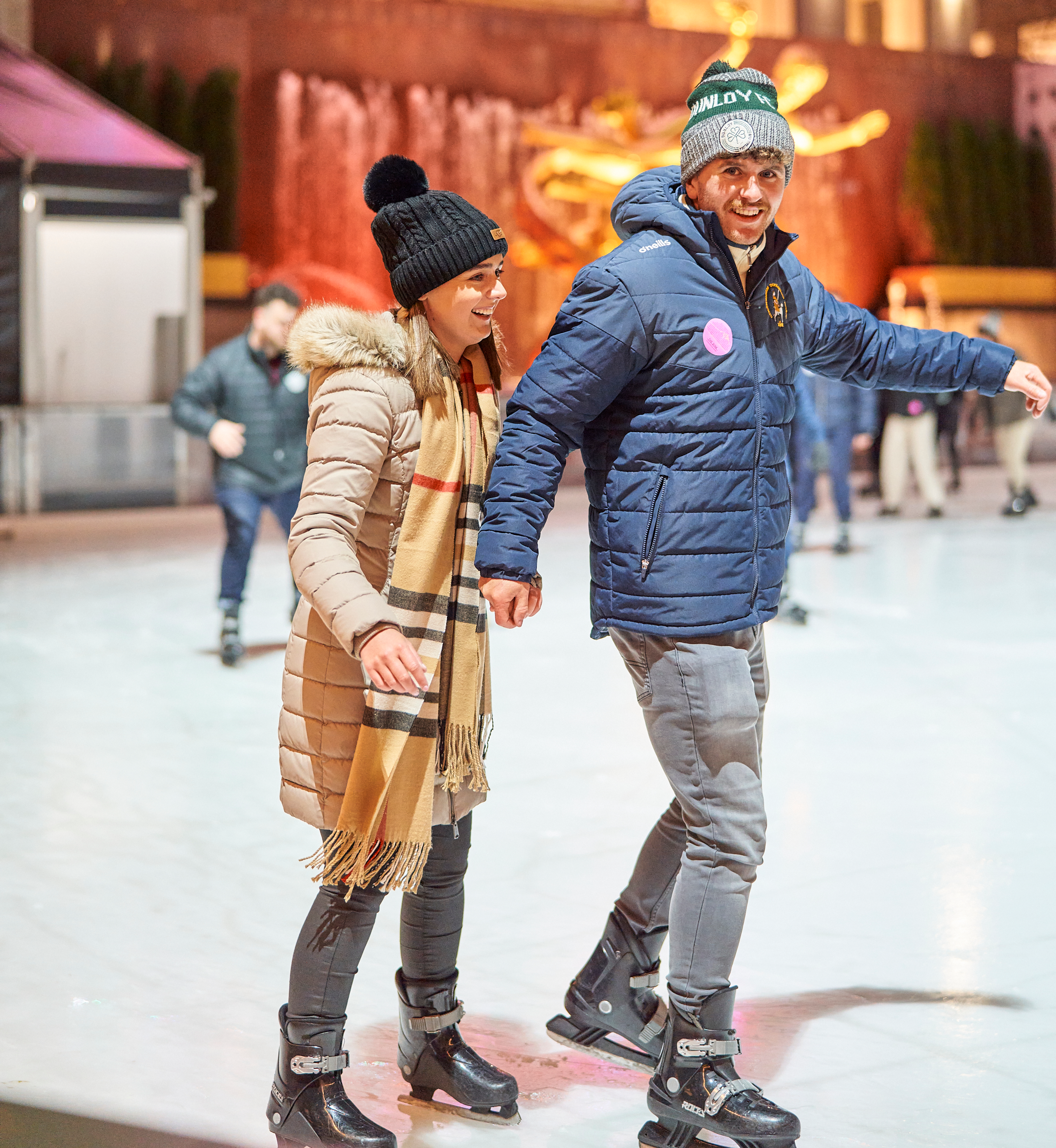 A couple ice skating on The Rink at Rockefeller Center Presented by Chase Freedom