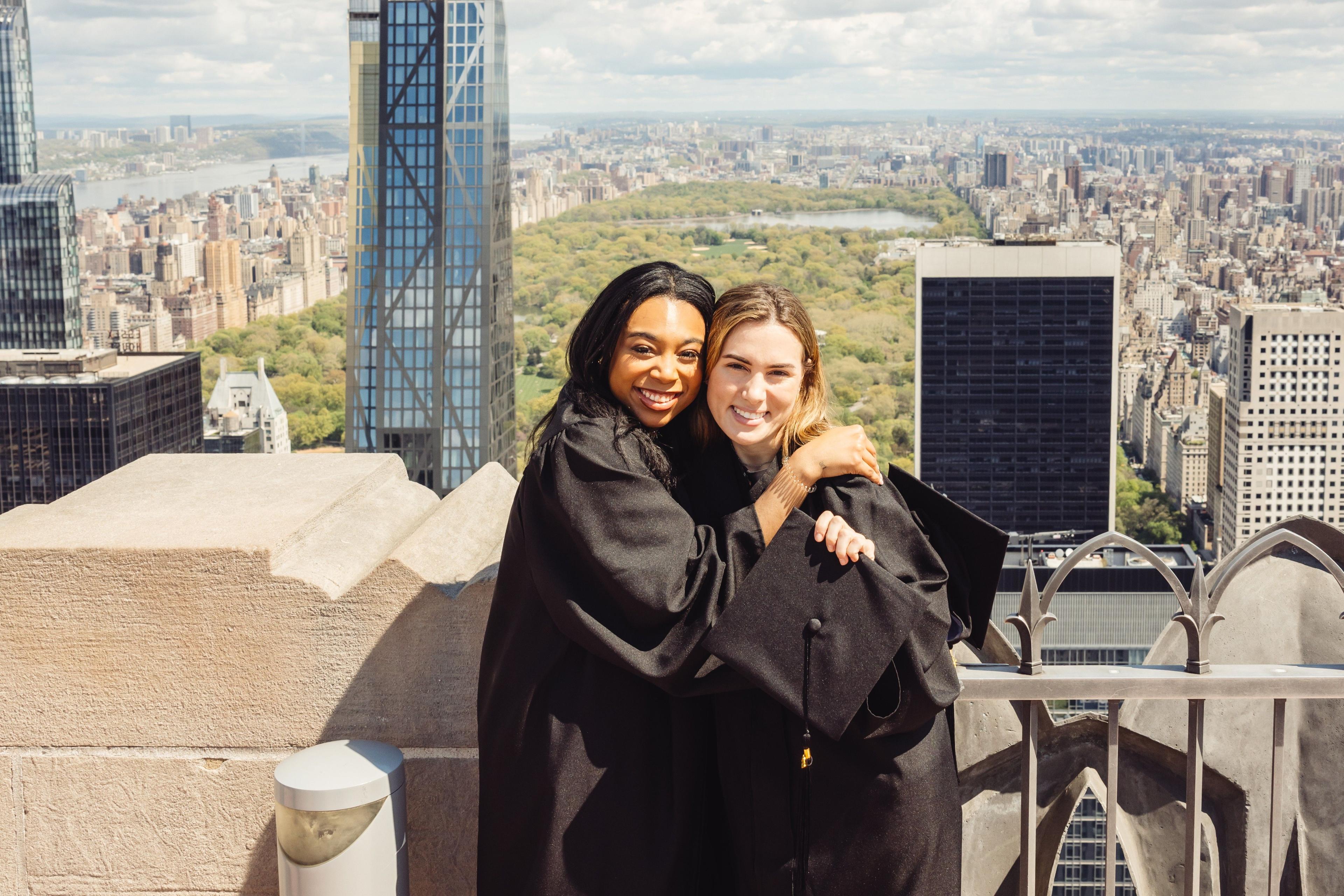 two graduates at top of the rock