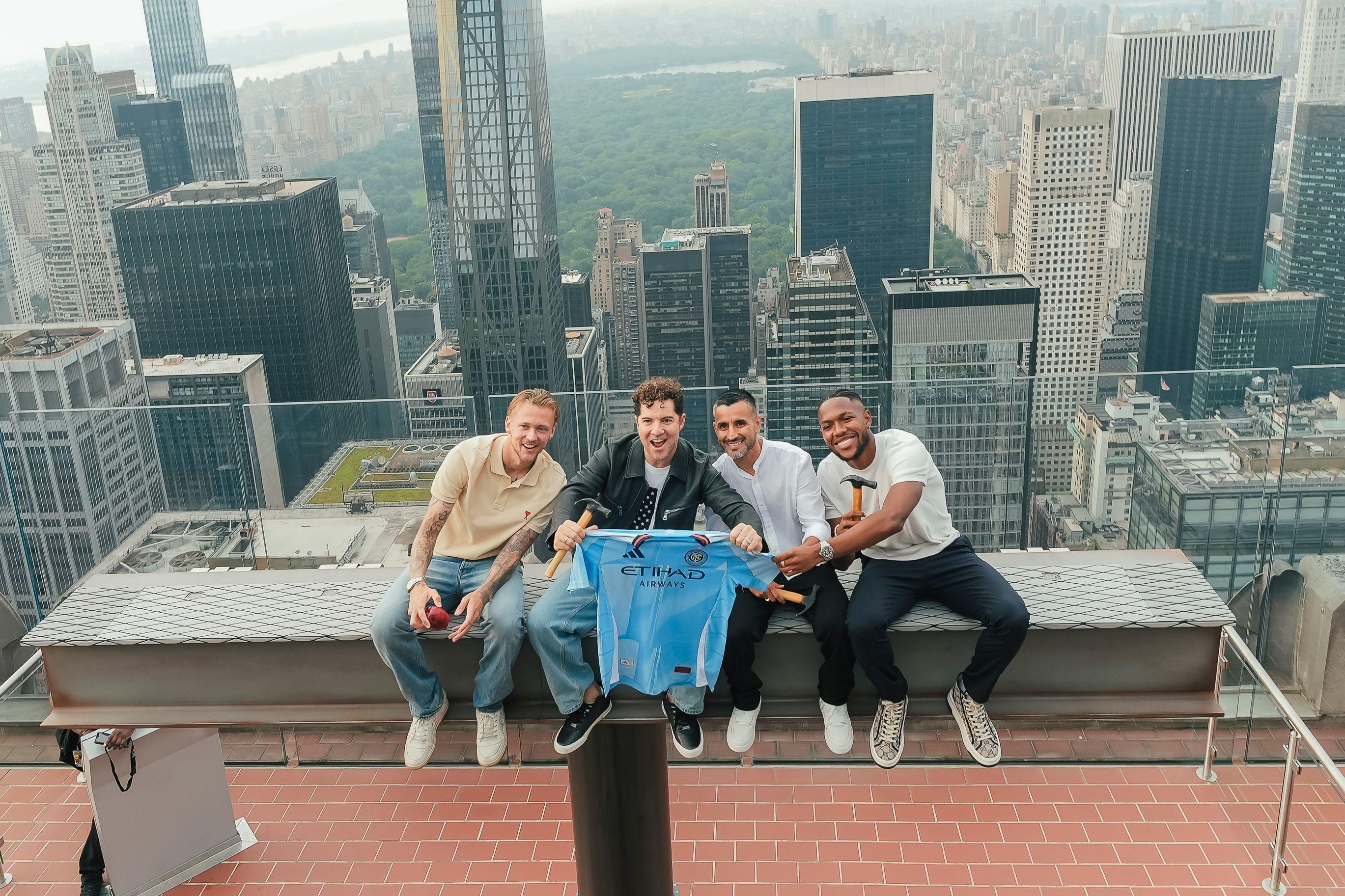 David Bisbal & NYCFC on the beam at top of the rock