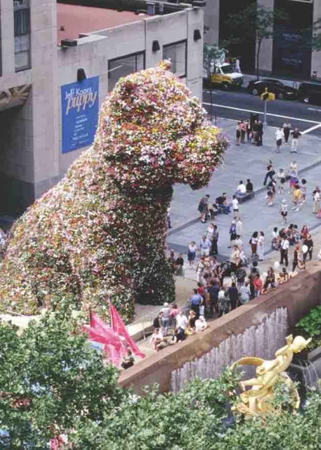 Giant puppy statue constructed of flowers