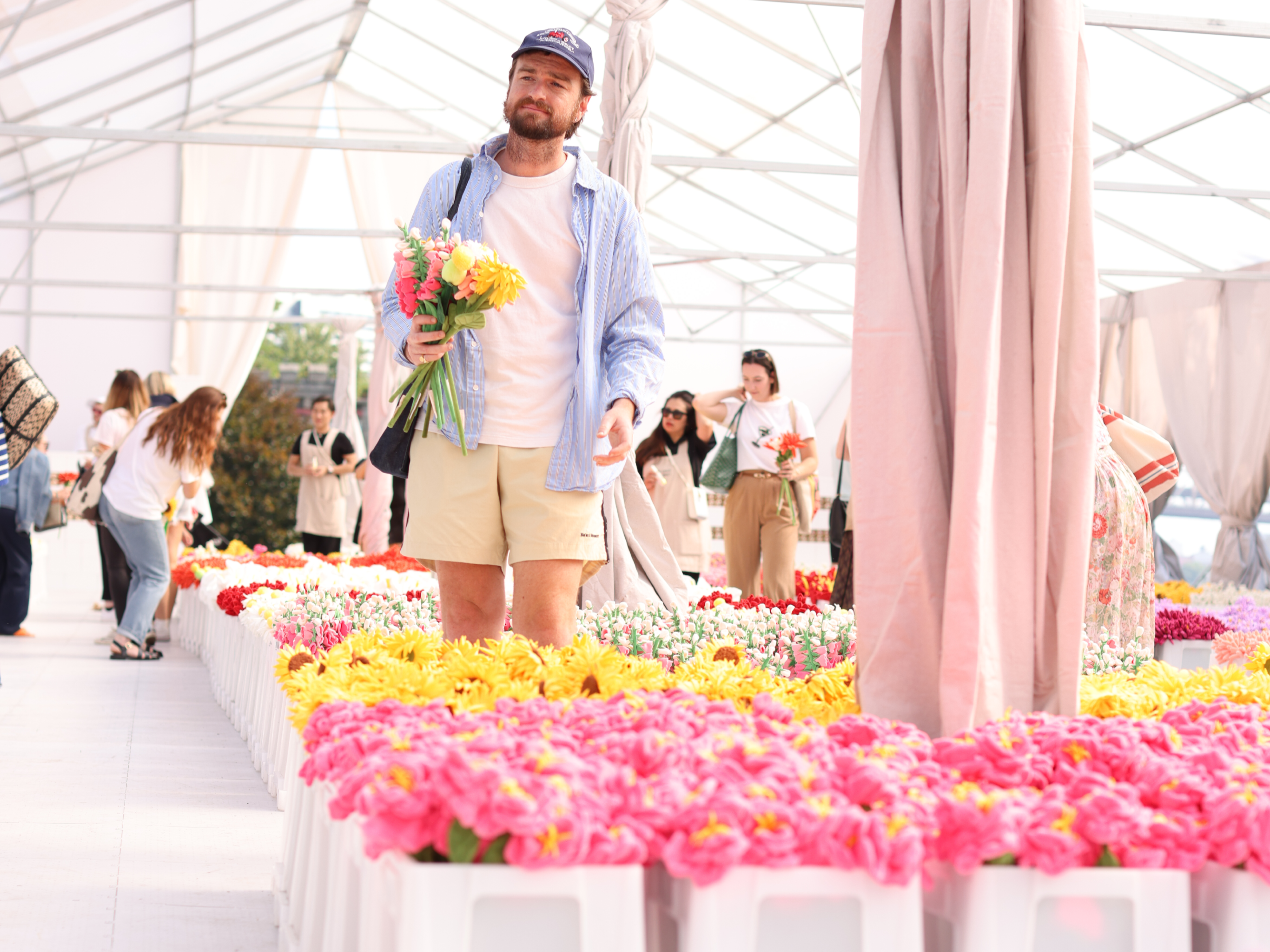 Person picking flowers at artist Cj Hendry's Flower Market