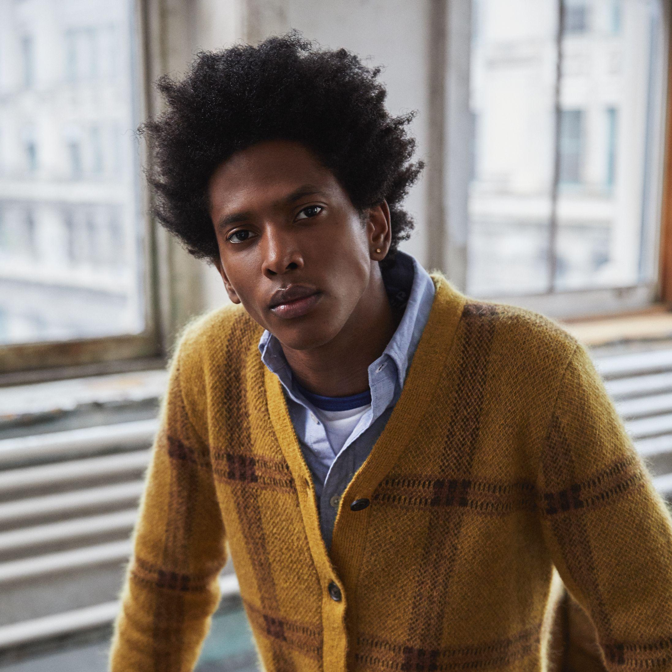 Man in yellow cardigan and gray pants from Todd Snyder