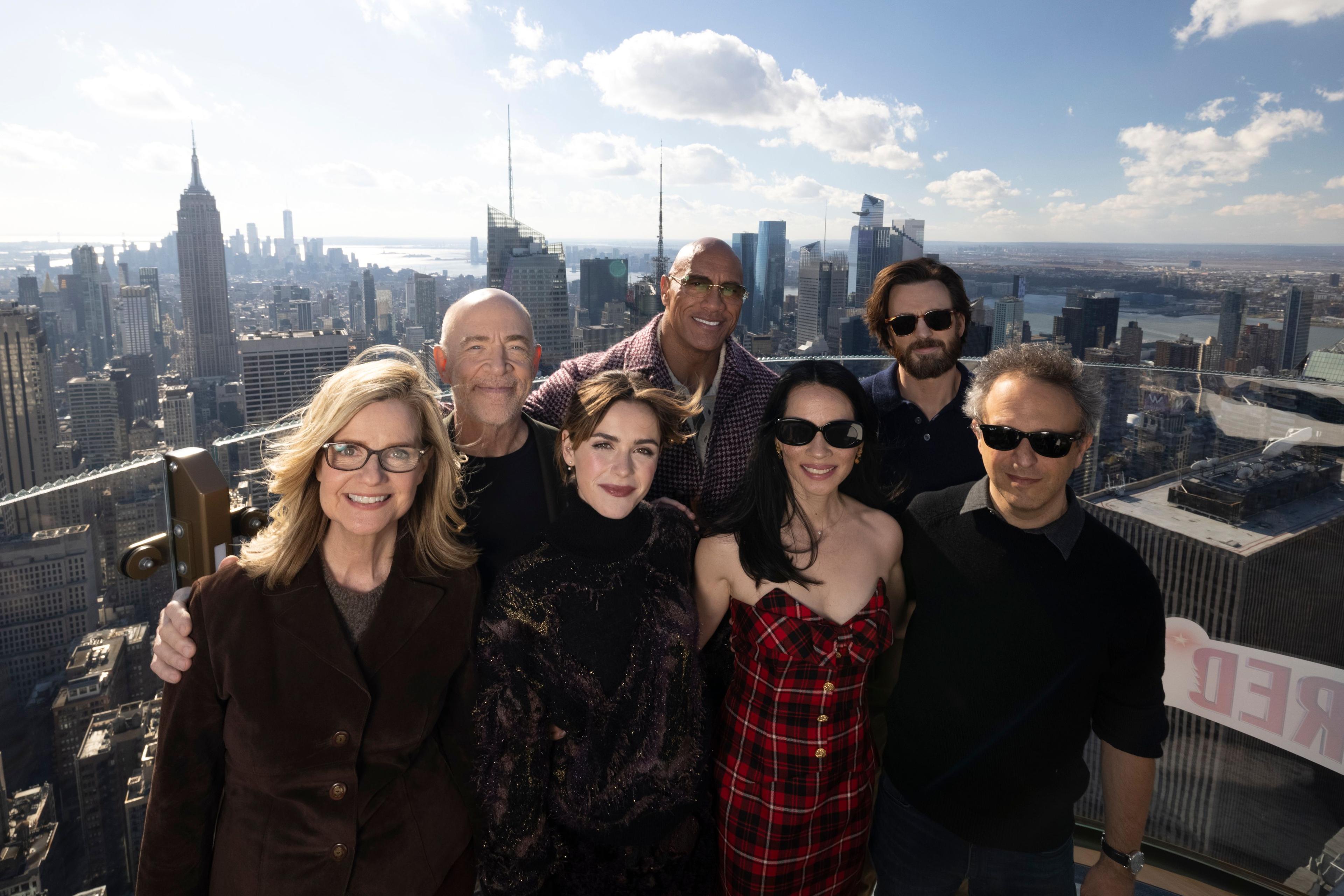 the cast of red one on skylift at top of the rock