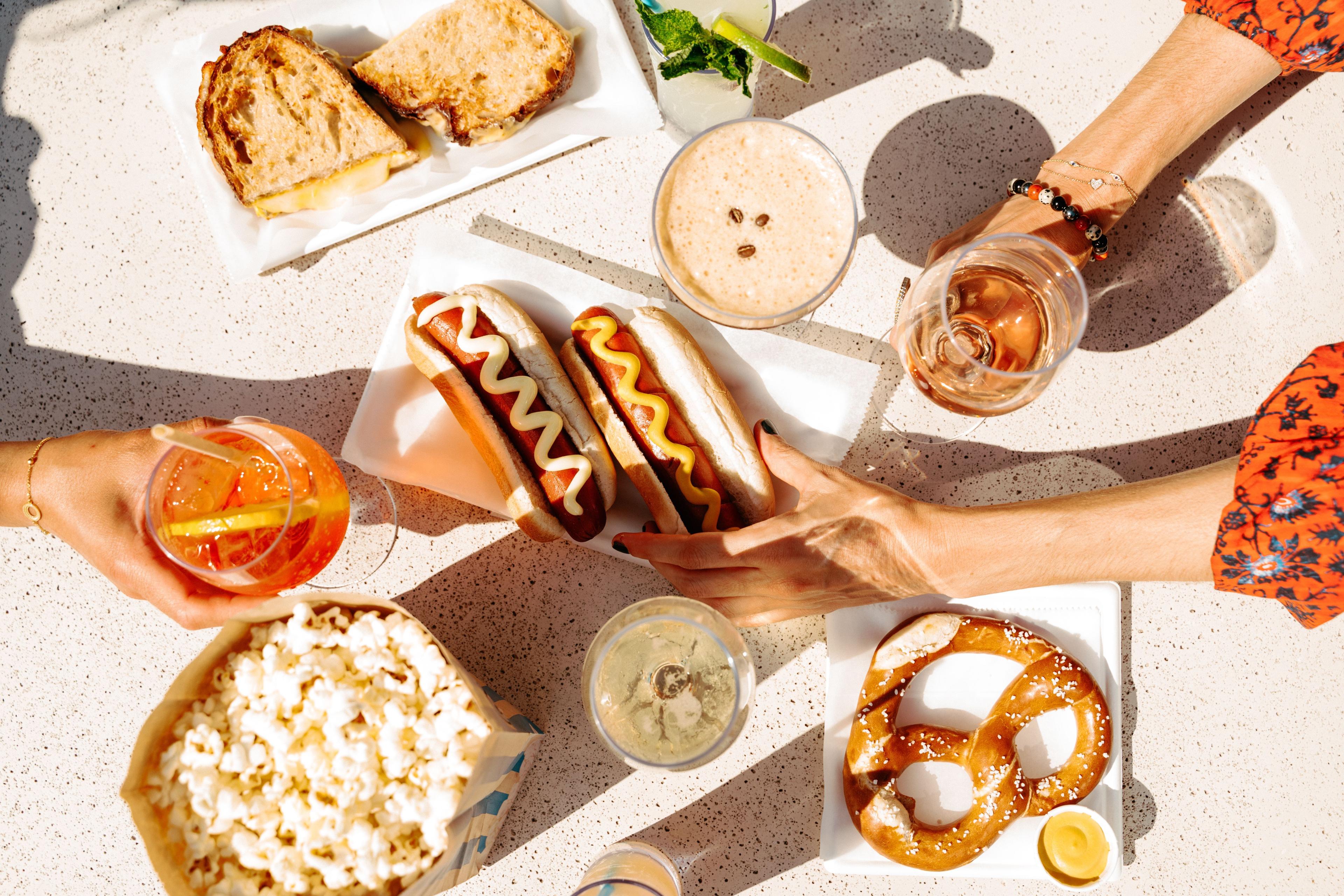 hot dogs, popcorn, pretzels, and cocktails