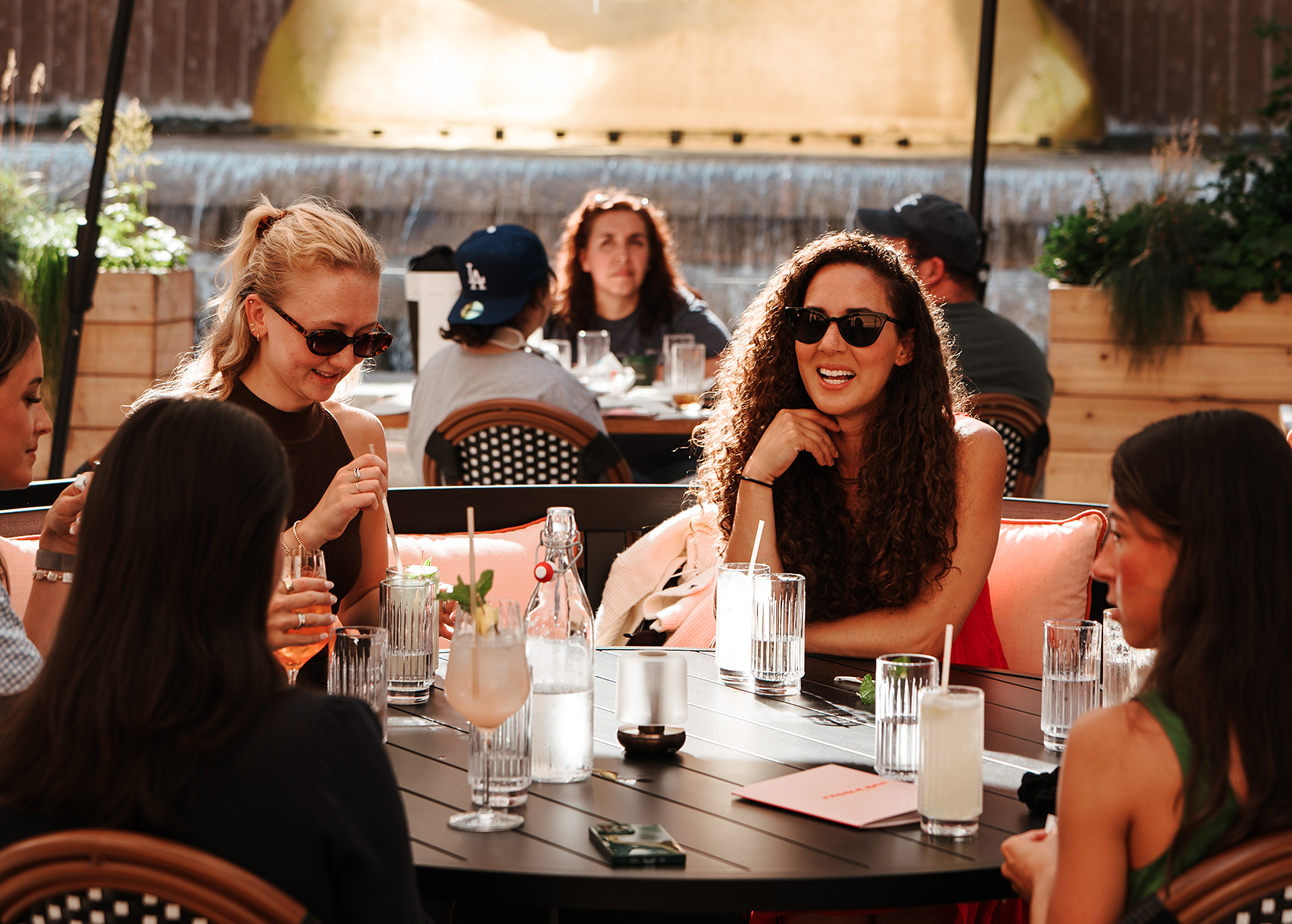 Group of women sitting around a table lorem