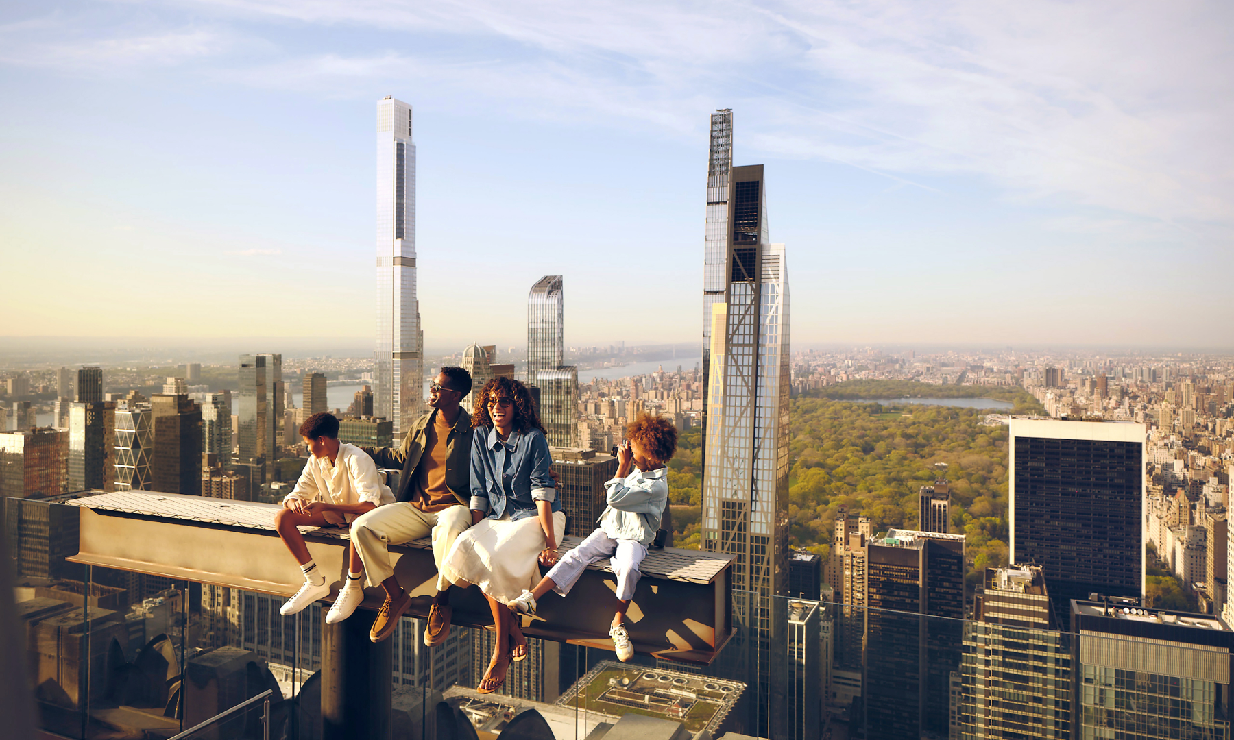 A family of four on The Beam at Top of the Rock