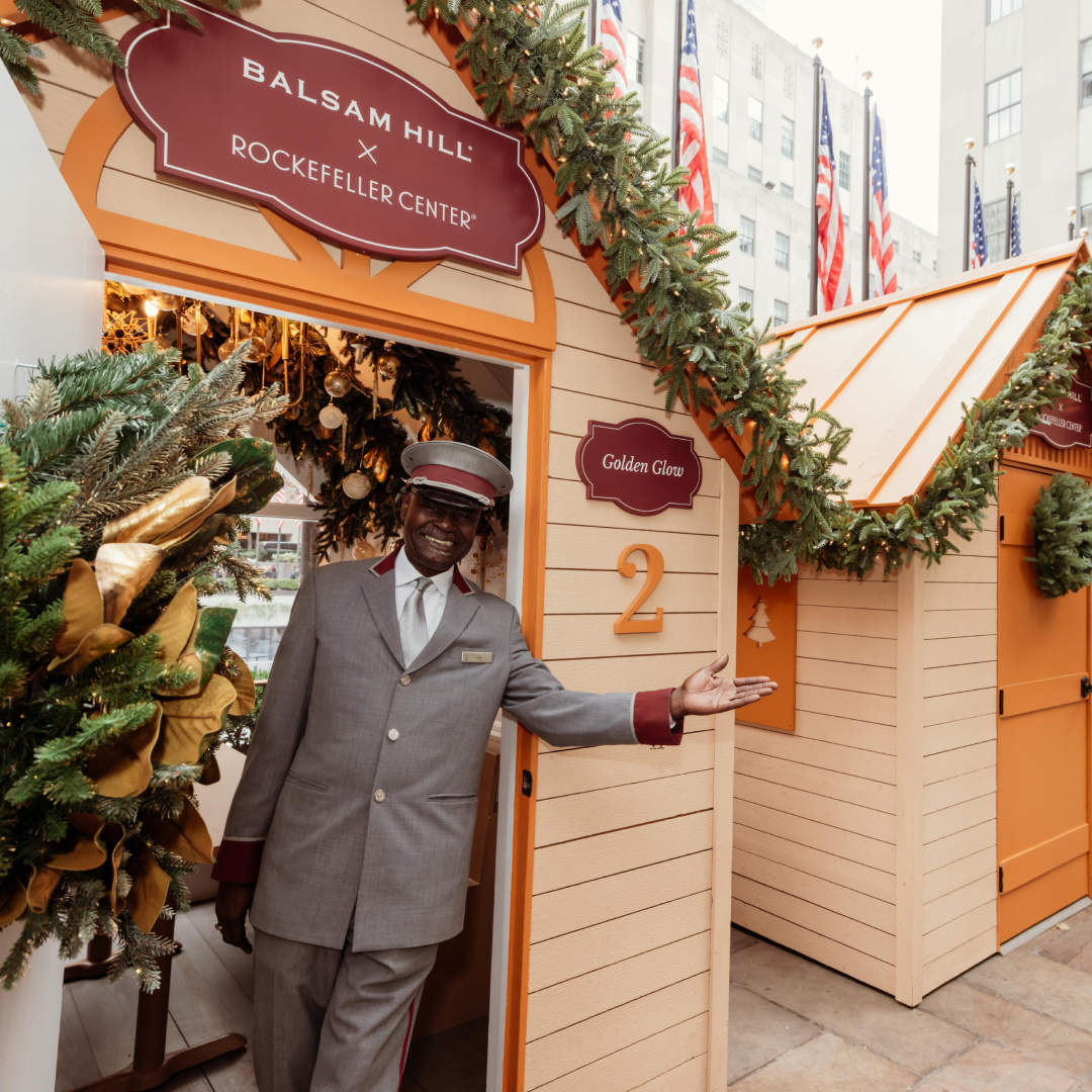 Correll Jones, mayor of Rockefeller Center, standing in front of The Rink's Après Skate Chalets