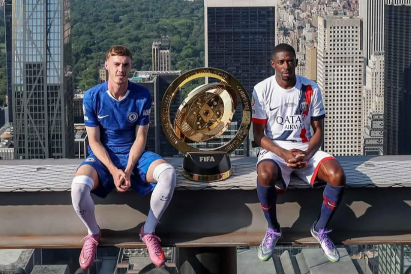 Cole Palmer and Ousmane Dembélé on the beam at top of the rock