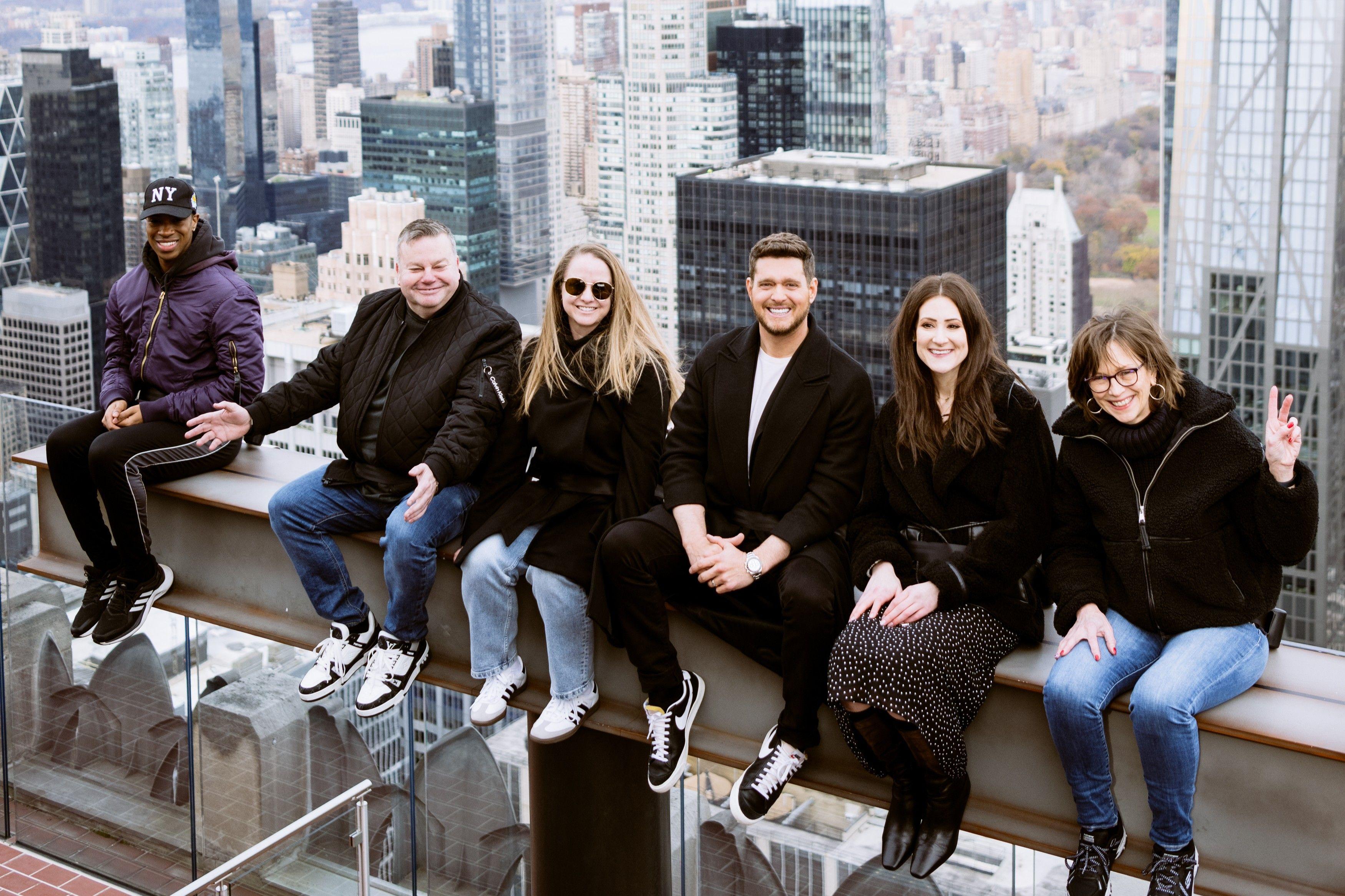 Michael Bublé on the beam at top of the rock