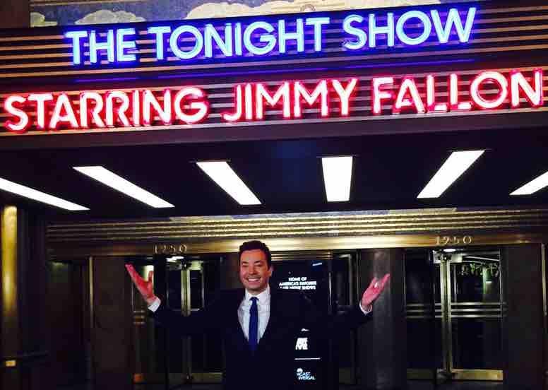 Jimmy Fallon in front of the Tonight Show marquee