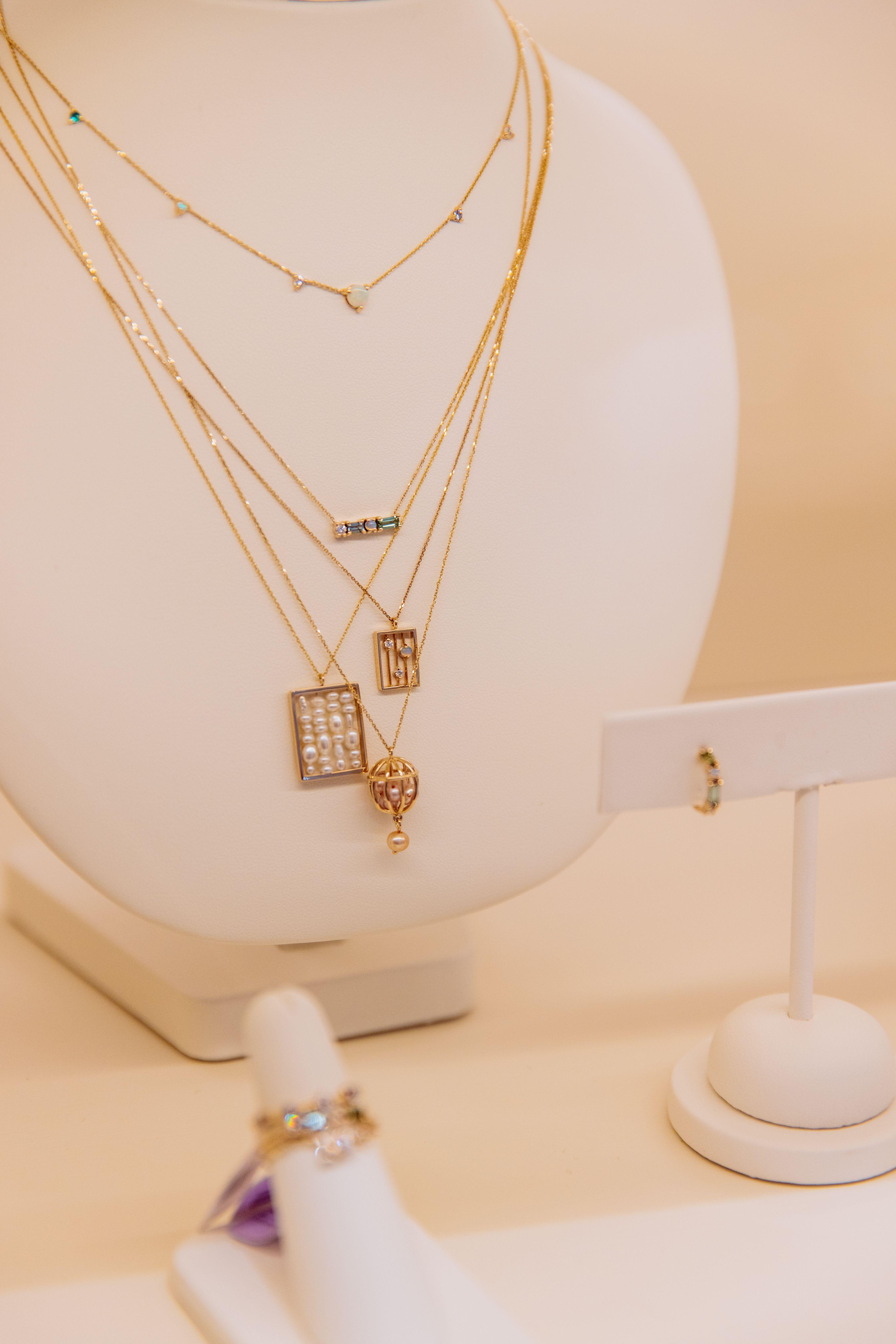 Necklaces layered on a display