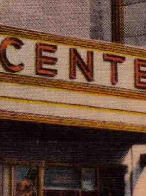 Vintage photo of the Center Theatre marquee at Rockefeller Center in the 1930s, featuring Art Deco signage above the entrance.