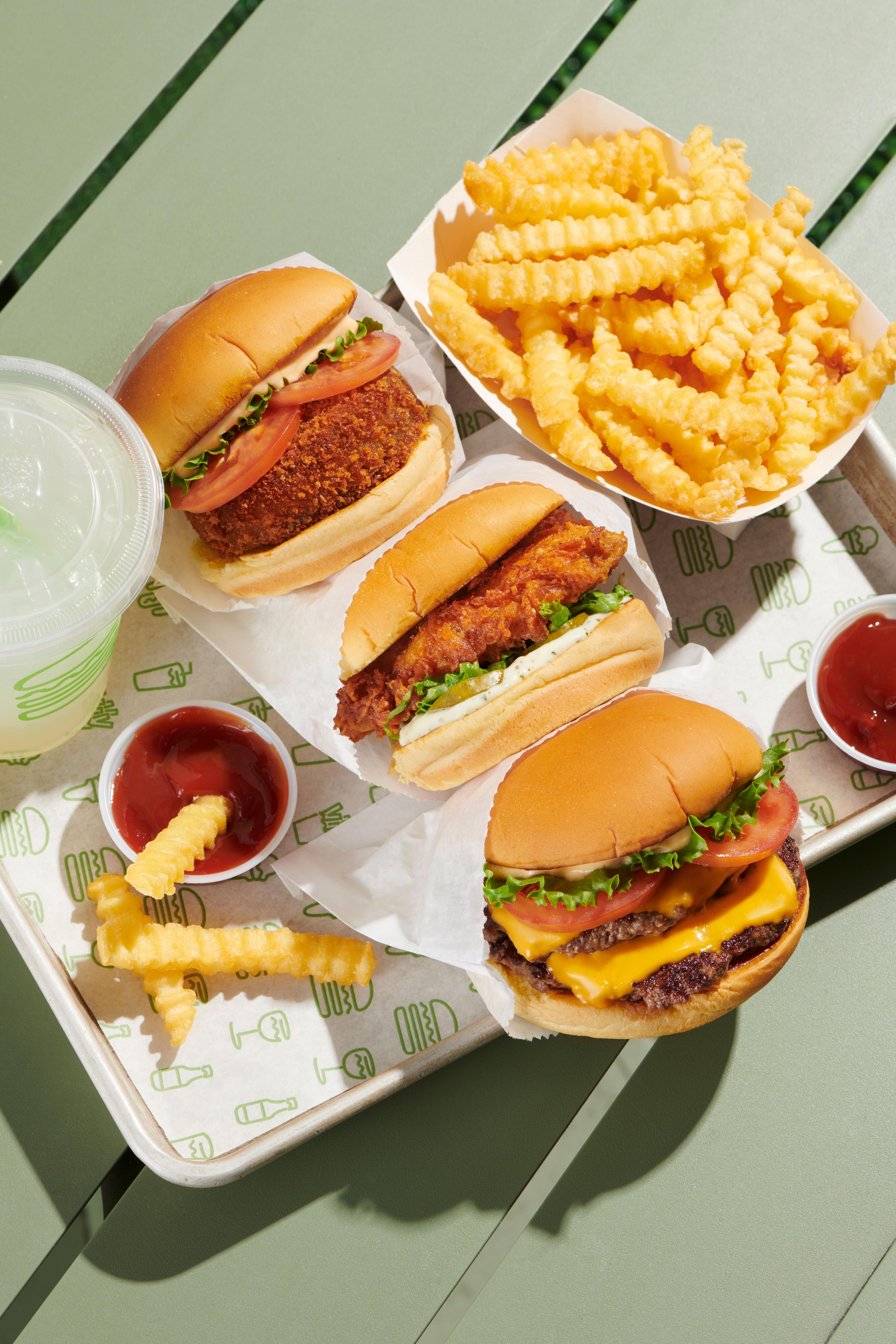 A burger, milkshake and fries on a table