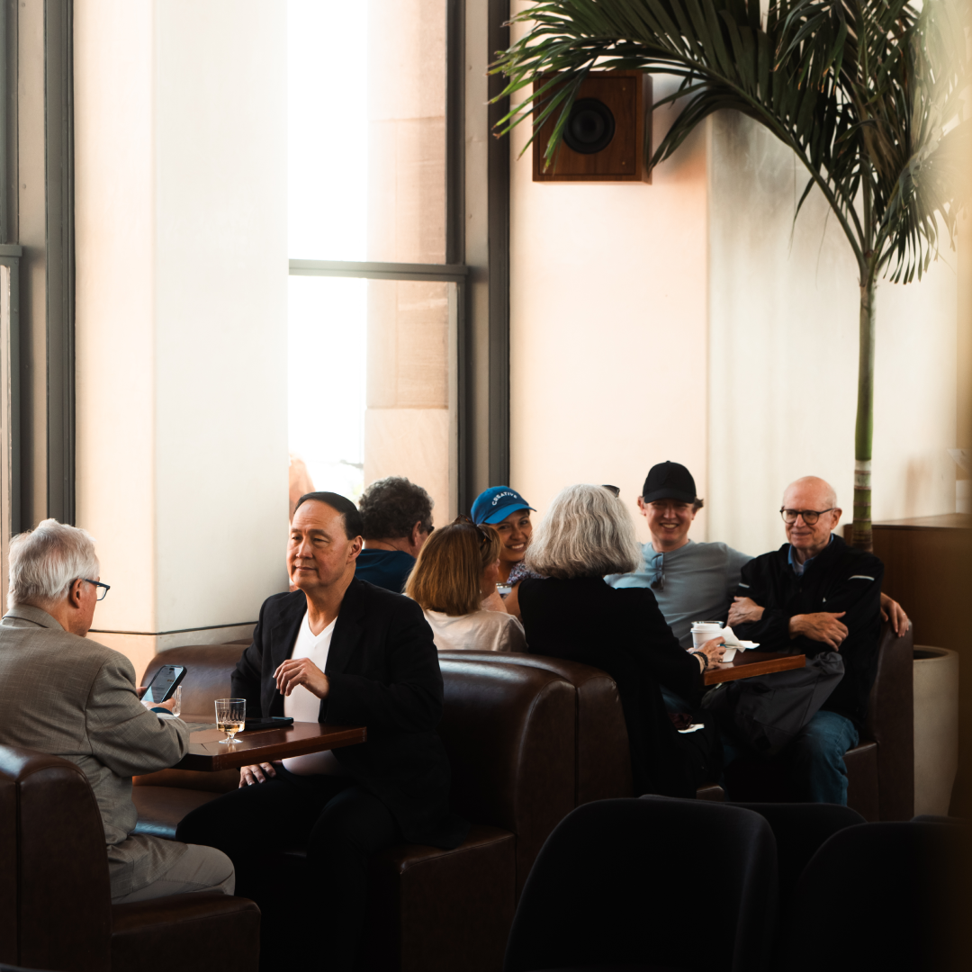Groups of people sitting at booths inside The Weather Room at Top of the Rock